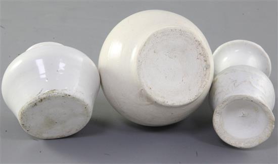 A Chinese Dehua white glazed bottle and two Dehua white glazed vases, Yuan-Ming dynasty, 5.7cm - 9.3cm